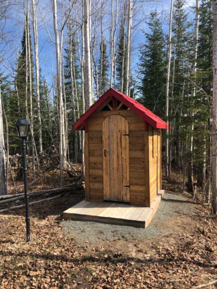 Small wooden outhouse